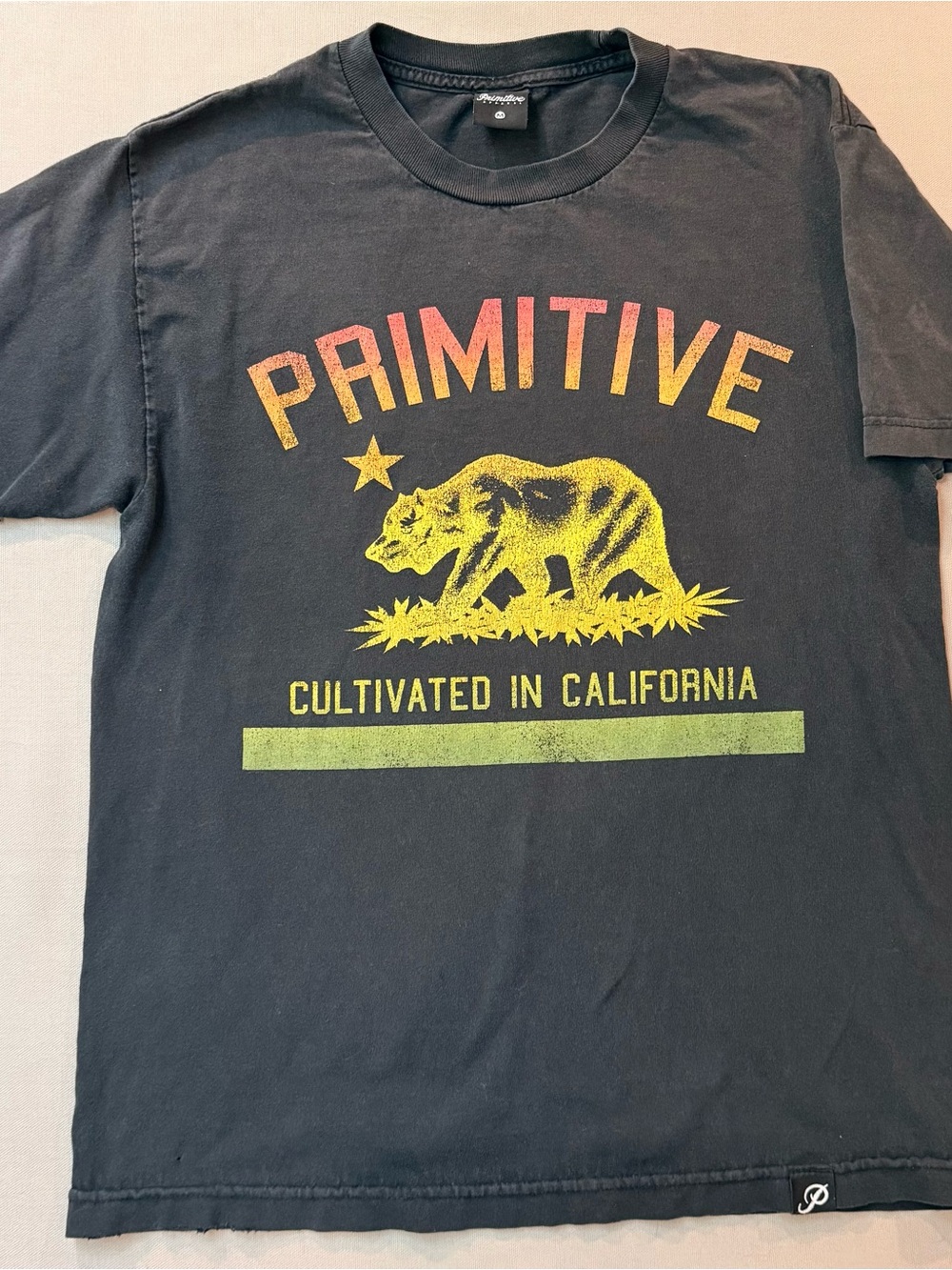 Primitive Black Tee with Yellow and Pink Gradient Graphic